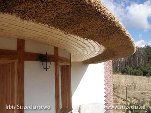 Thatch: finished soffit, wall stylized as half-timbered also